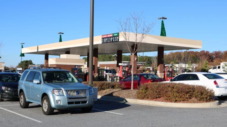The coronavirus vaccines might have contributed to a rise in gasoline prices illustrated by photo of Kroger gas station on South Cobb Drive