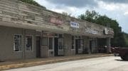 Sprayberry Crossing row of dilapidated storefronts -- there will be a hearing on redevelopment of the property