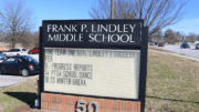Sign t Lindley Middle School in article about MIC education forum