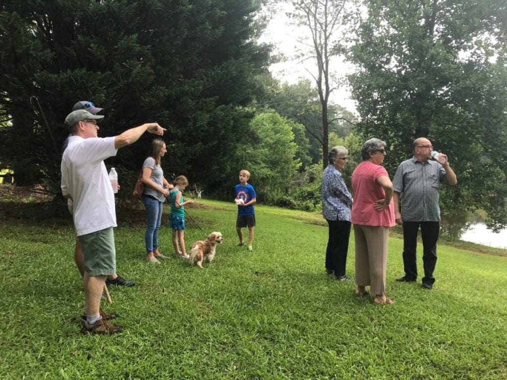 Cobb County Commissioner JoAnn Birrell shows residents around the new park property (photo by Rebecca Gaunt)