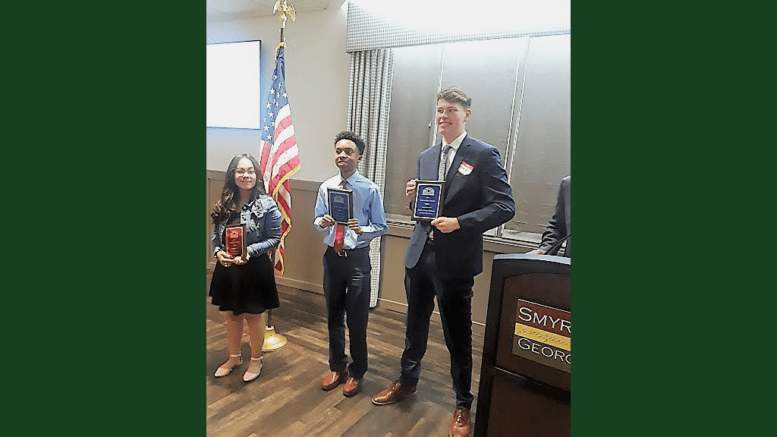 Ana Martinez, Eddie Richardson, and Charles Milliron receive scholarships from Smyrna Business Association