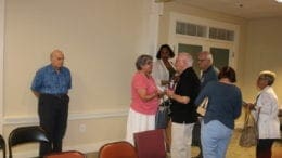 District 3 Commissioner JoAnn Birrell talks with constituents after the town hall (photo by Larry Felton Johnson)