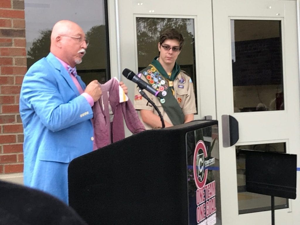 Eddie Graham displays his original Brumby Bobcats jersey. (photo by Rebecca Gaunt)