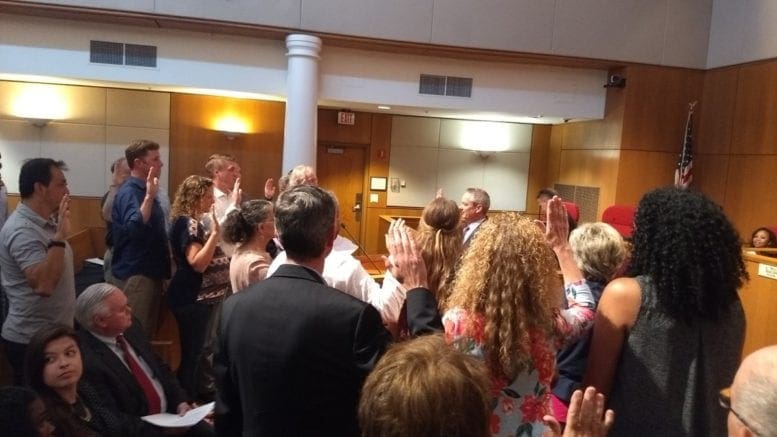 Smyrna City Attorney Scott Cochran swears in more than a dozen public speakers during Monday night's city council meeting for hearing on Cumberland Community Church property (photo by Haisten Willis)
