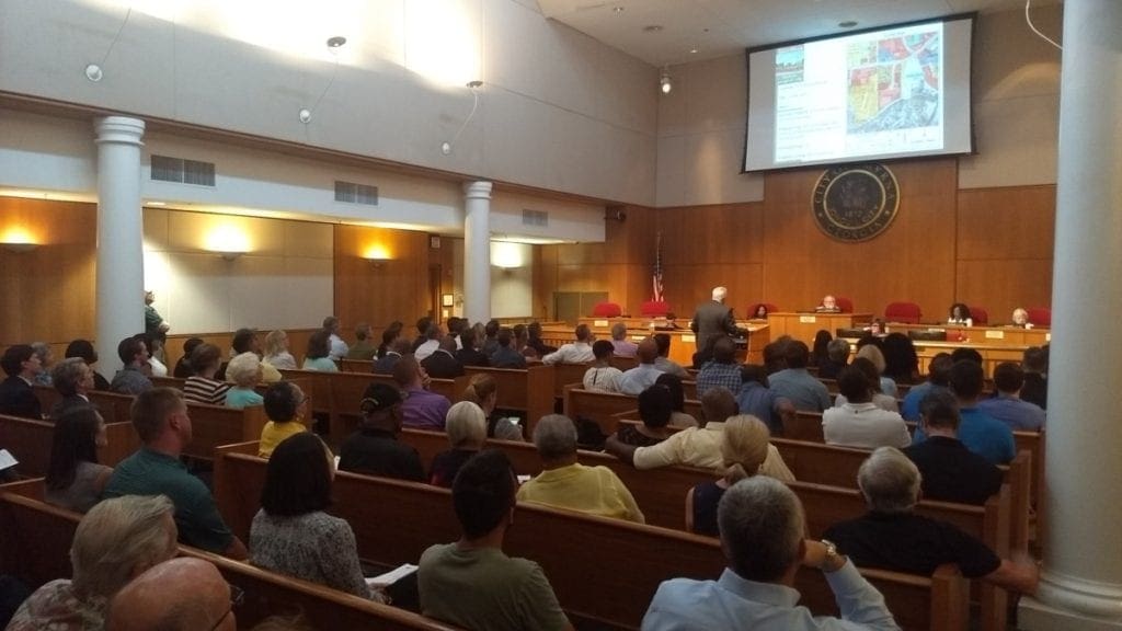 Smyrna Community Development Director Ken Suddreth speaks in front of a packed house at City Hall Monday night (photo by Haisten Willis)