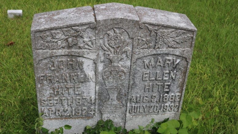 an old and moldy headstone