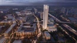 A silvery tower of the thyssenkrupp facility rising above the Battery area adjacent to SunTrust Park.