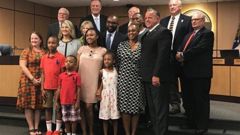 Dawn Harrell (in black and white dress second from right) of Nickajack ES was recognized as the Elementary Teacher of the Year, with students and Cobb school board members and staff