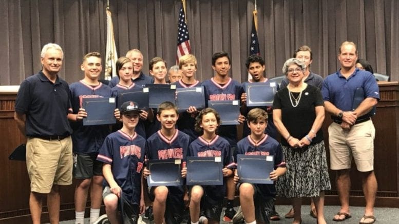 Commissioner JoAnn Birrell congratulated the Sandy Plains Prowlers travel baseball team who finished its season with a 65-11 record and five championships. (photo by Rebecca Gaunt) in article about new Cobb police headquarters