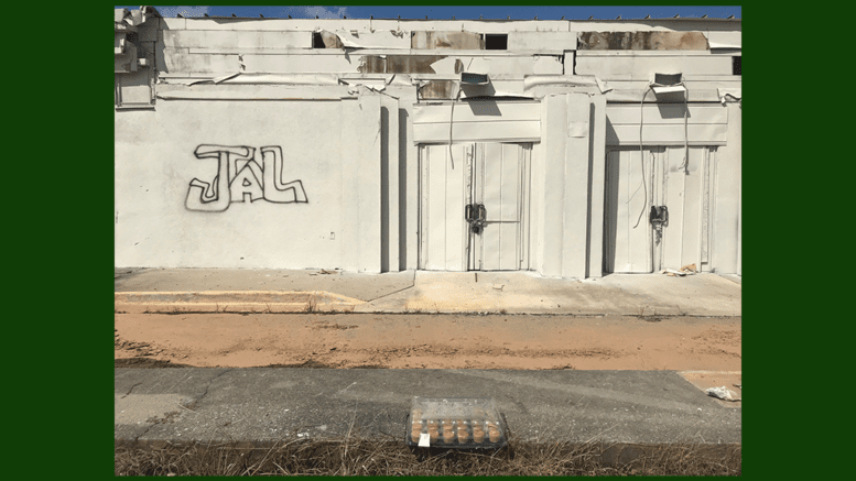 dilapidated bowling alley storefront at Sprayberry Crosssing