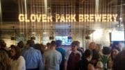 Crowd in front of Glover Park Brewery sign during the opening