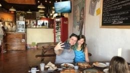 Local resident Meghan Cooper snaps a selfie with her daughters while enjoying “Roman style pizza” at Pizza by Fusco’s, one of the participating restaurants in the selfie challenge (photo by Meghan Cooper)