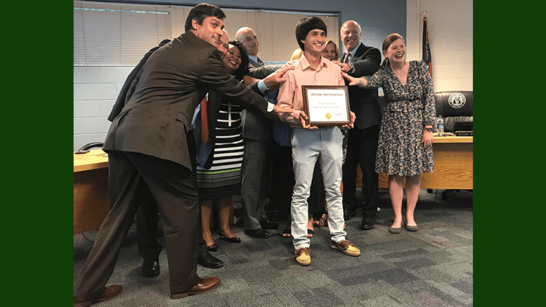 Grant Rivera and board members joked that they felt smarter just being in the presence of Andy Chinuntdet, who received a perfect ACT score.