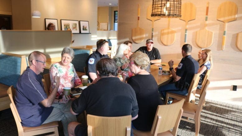 Officers Penirelli and Conwell chat with neighbors at Cobb police Precinct 2 Coffee with a Cop day (photo by Larry Felton Johnson)
