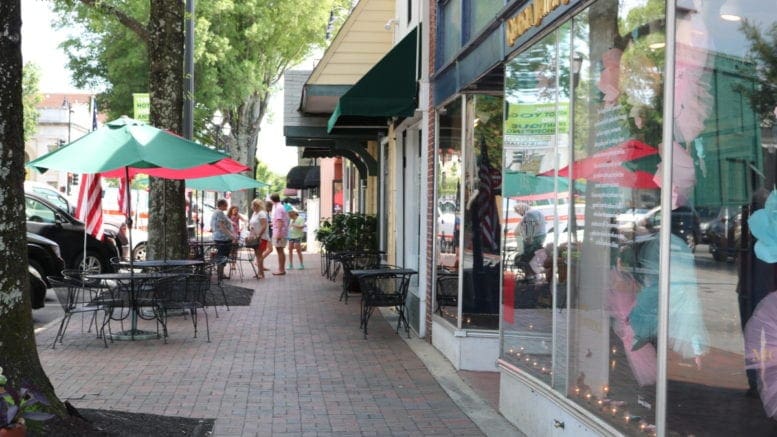 A row of narrow storefronts along Marietta Square, directly across from Glover Park