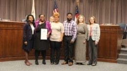 (L-R) Commissioner Lisa Cupid; Lasondra Howard-Boddie, Cobb County Director of DFCS; Everlean Rutherford; Brandon Rutherford; Danielle Farrelley, Resource Development Supervisor, DFCS; Carmen Nance, Cobb County DFCS Deputy Director (photo by Larry Felton Johnson)