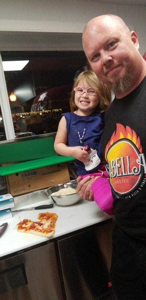 Carlos Bickers and his daughter Isabella, for whom the restaurant is named (photo provided courtesy of Isabella's Pizza and Wings)