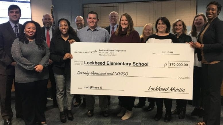 Lockheed Martin Aeronautics Company presented a $70,000 grant to Lockheed Elementary’s Principal Coretta Stewart (far right). (photo by Rebecca Gaunt)