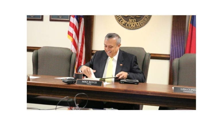 a converation with Mike Boyce -- photo of him seated at a table at the beginning of his first term.