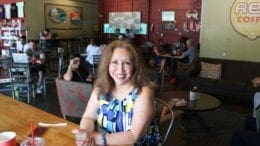 Laura Mireles seated at a table at Rev Coffee (photo by Larry Felton Johnson)