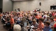 Crowd at Campbell Middle School for meeting about Sterigenic plant