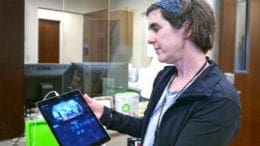 Amy Woodell, Evidence-Based Coordinator for Cobb Senior Services demonstrates security features on an iPad at the Assistive Technology Lab located at Senior Wellness Center at 1150 Powder Springs Street in Marietta. Visitors are invited to schedule tours of the AT Lab to learn about products that improve the quality of life for seniors and people of any age that may need. (photo by Margaret Waage