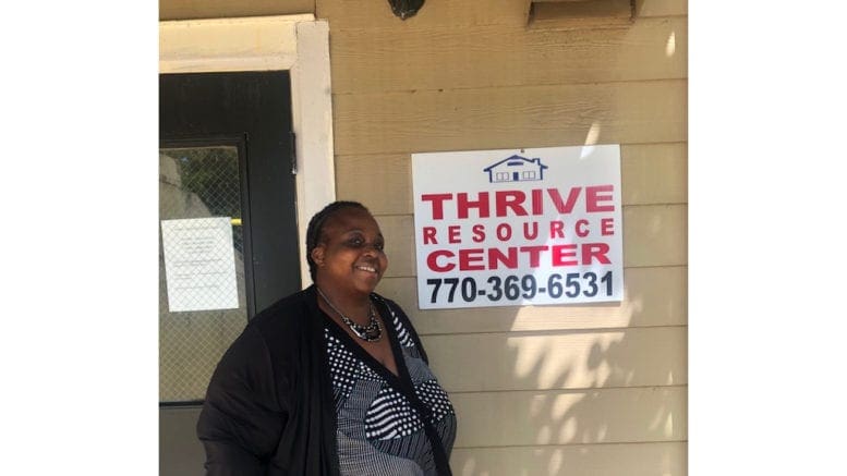 Cobb District 4 candidate Monica DeLancy stands in front of the Thrive Resources Center in Austell, Georgia at Kingsley Village Park Apartments. DeLancy founded “We Thrive” to empower renters through the education of their rights and advocacy.
