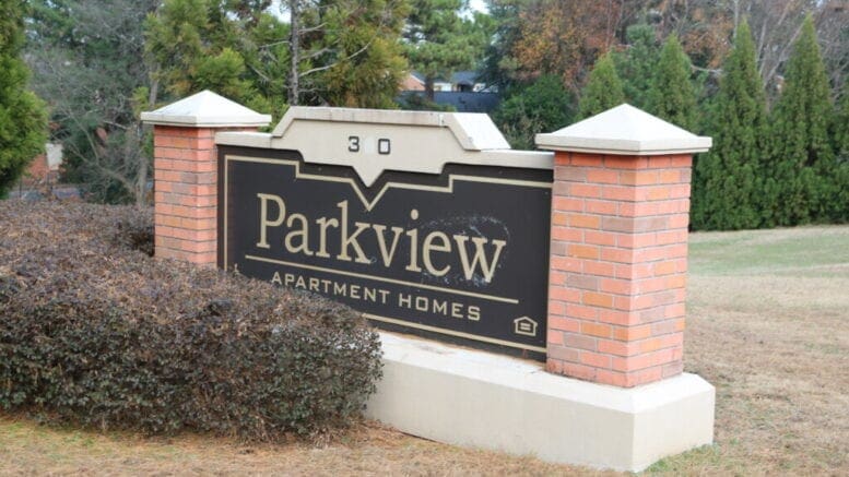 Parkview Apartments, brick sign in front of the complex in article about the purchase of three complexes by Lexington Austell