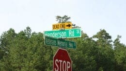 Henderson Road sign in article about Henderson Road park