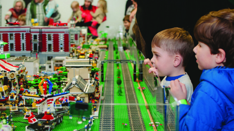 Children watching electric trains from a previous Trains! Trains! Trains! event