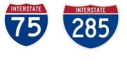 I-75 and I-285 signs in article about GDOT lane closures in Cobb