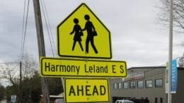 Crossing sign for Harmony-Leland Elementary School in article about bridging the digital divide