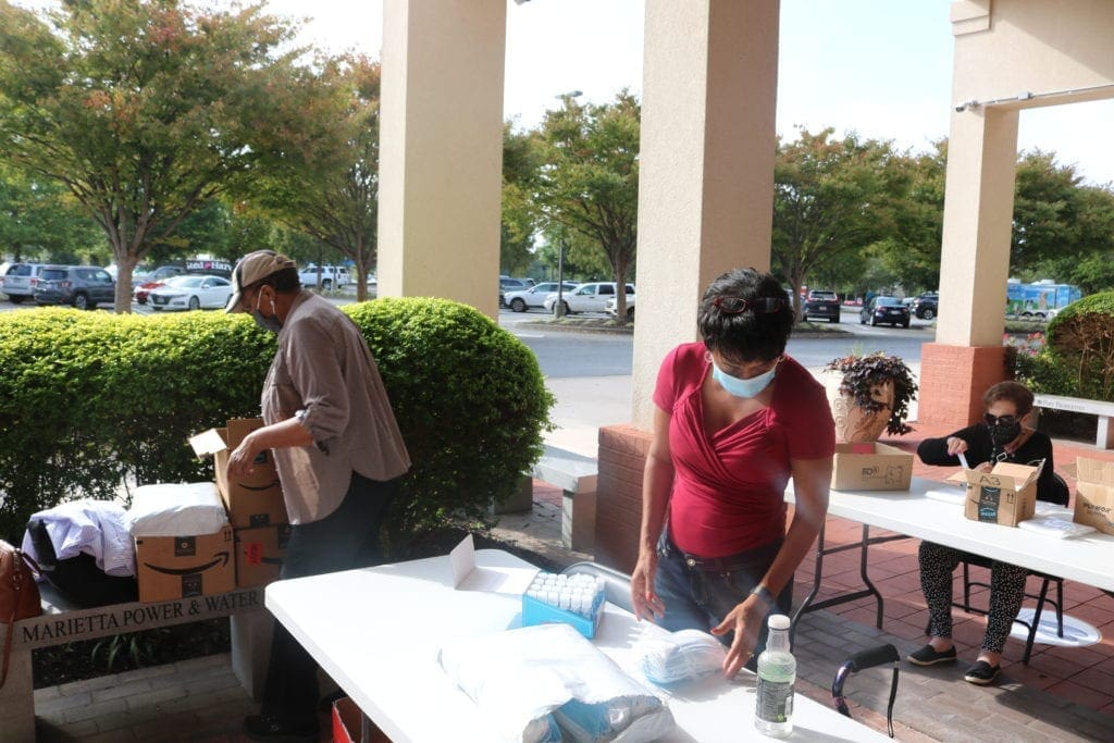 Members of SCC constructing the Vial for Life packets