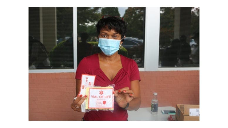 Senior Citizen Council of Cobb member Vera Kiser displays finished Vial of Life packet