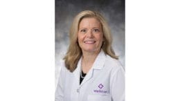 Dr. Laura Pearson in white Wellstar lab coat