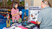 Kennesaw Winter Kick Off photo of woman at Kennesaw Parks & Rec display with man behind table