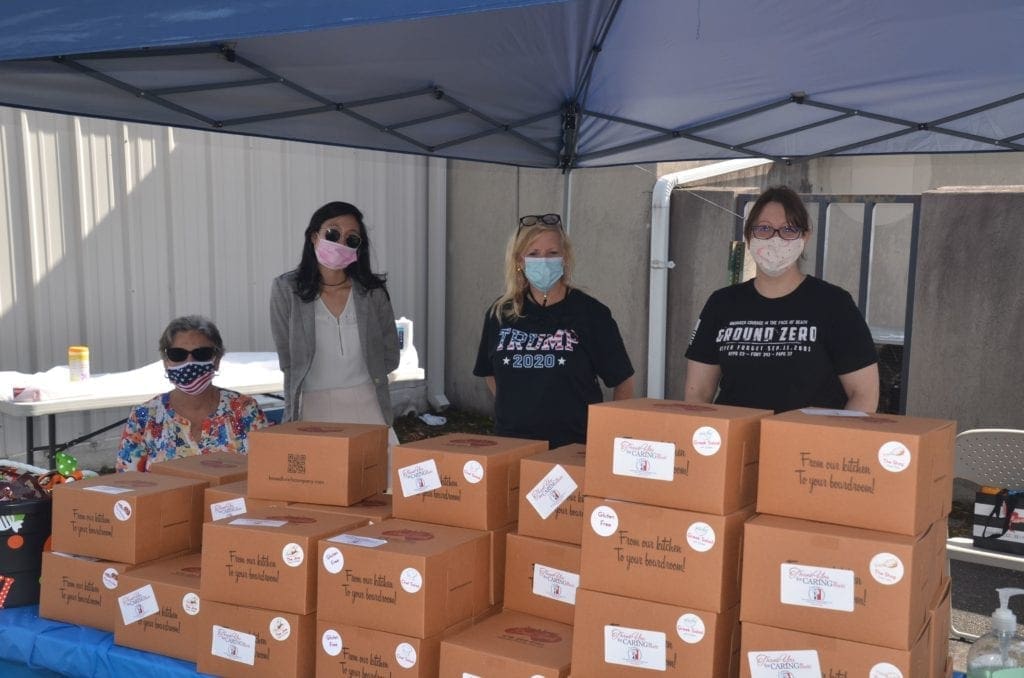 Volunteers at Police Headquarters serving Lunch from Amy and Tammys boxed Lunches