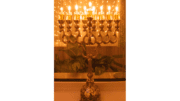 A photograph of a Menora, a nine-candle holder