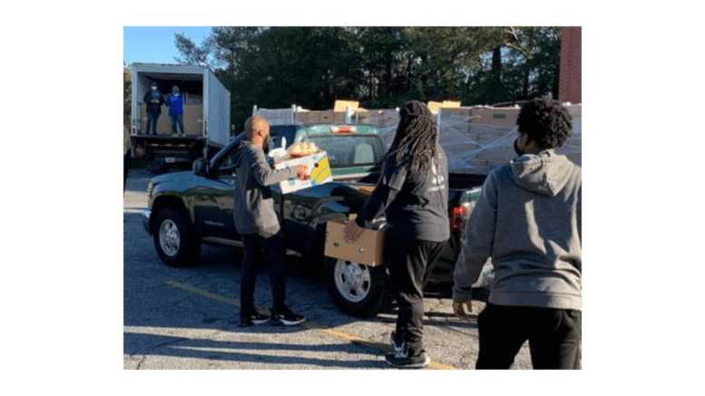 Volunteers loading food at Reflections of Trinity Food distribution in Powder Springs