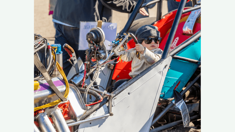 Touch-a-Truck image of a child in a drag racer