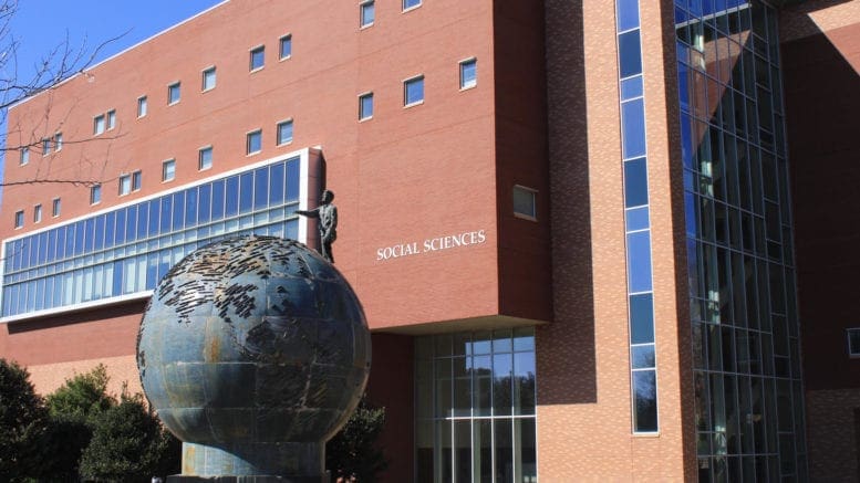 KSU social science building with globe sculpture