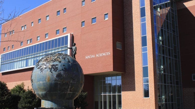 KSU social science building with globe sculpture