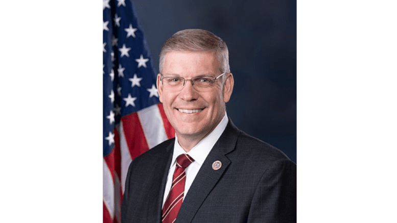 headshot of Representative Barry Loudermilk with flag behind his right shoulder