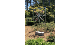 Sculpture of a design in a frame in a garden