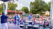 Performers on an outdoor stage at a Kennesaw Salute to America