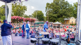 Performers on an outdoor stage at a Kennesaw Salute to America