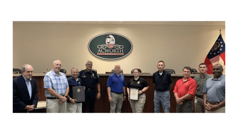 line of people some holding certificates from GACP