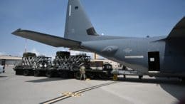 U.S Air Force personnel load a Rapid Dragon pallet onto an EC-130SJ aircraft ahead of an airdrop.