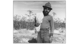 Young Hispanic male with bag thrown over shoulder