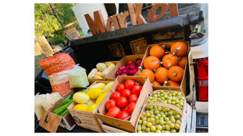 A stand full of vegetables and fruits